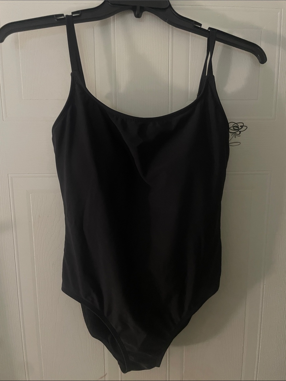 ANNE cole Woman’s Classic Black One-Piece bathing suit.